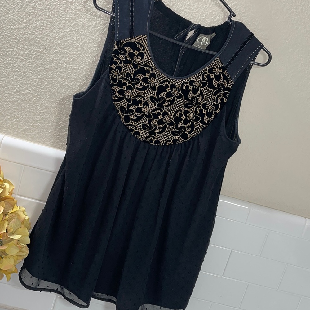 Anthropologie Black and Gold top . NEW excellent condition
